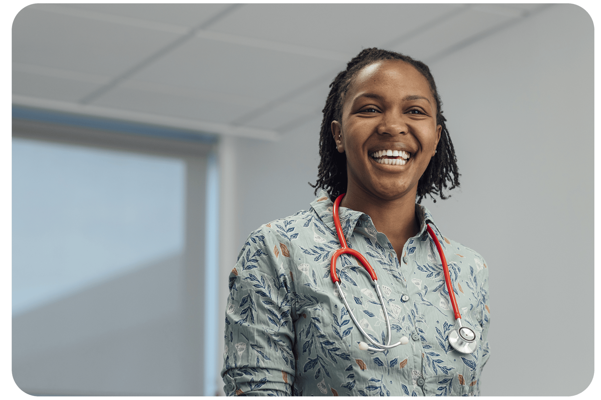 GP smiling after reduced workload through the Additional Roles Reimbursement Scheme